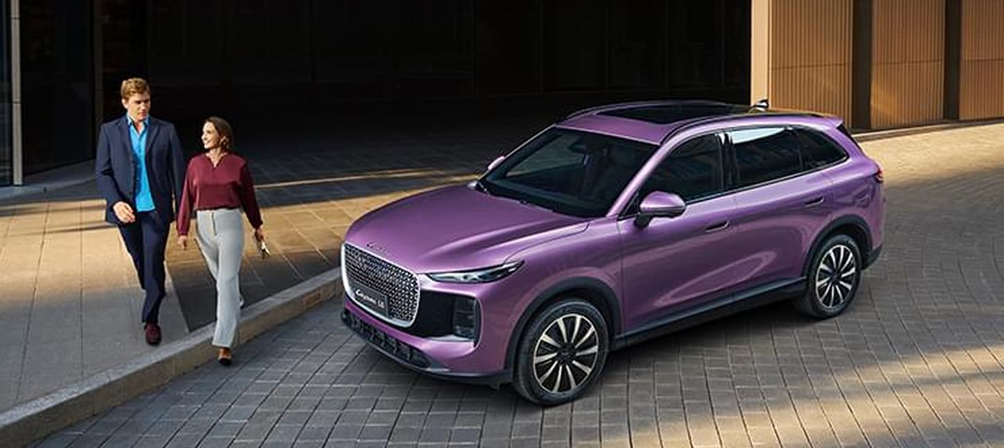 Purple LEPAS L8 beside two people outside a modern building